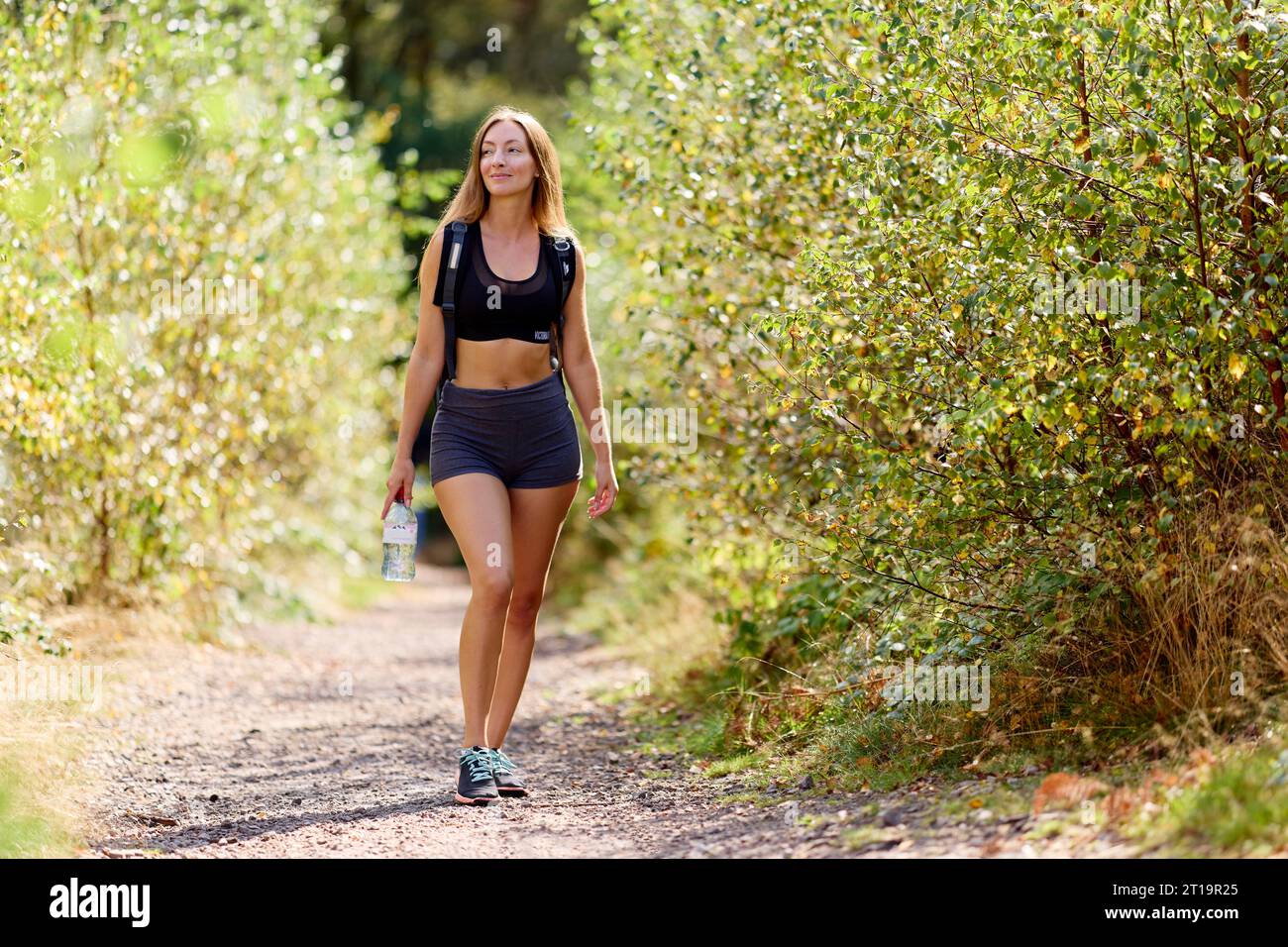 Woman relaxing outdoors Stock Photo - Alamy