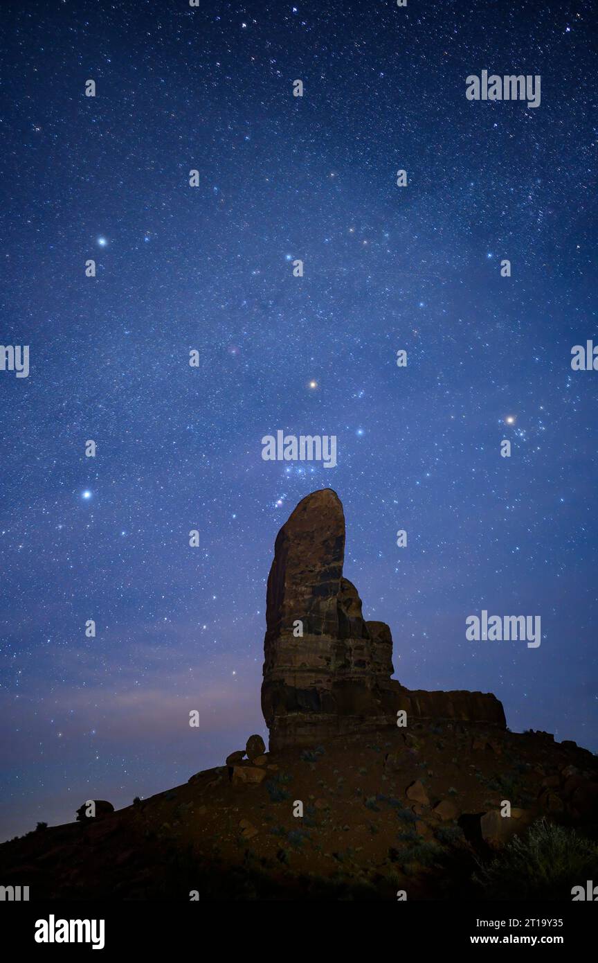 Stars over The Thumb sandstone formation in Monument Valley Navajo Tribal Park, Arizona. Stock Photo