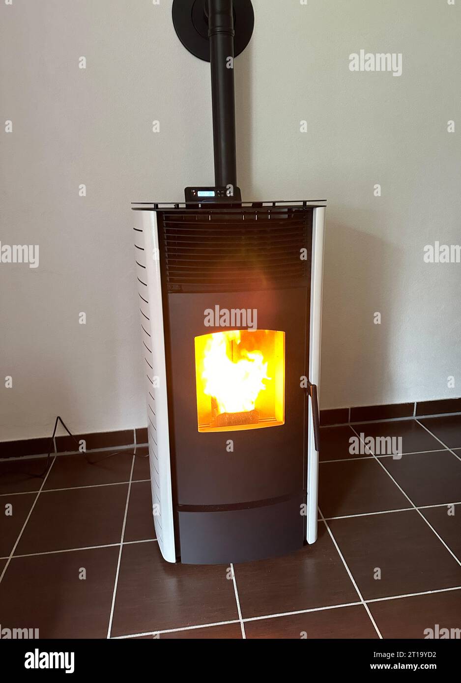 Pellet stove oven fireplace with pellets renewable energy Stock Photo