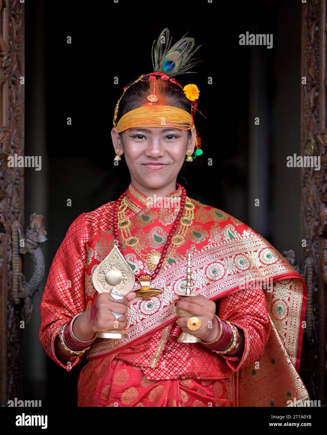 Lalitpur, Bagmati, Nepal. 12th Oct, 2023. A girl from Newar community attends a ritual of 'Barah', a traditional marriage to the sun in Lalitpur. Girls from Newar community pass through a tradition of marrying Sun God before puberty by staying inside a room without sunlight for 12 days and then coming out for a meeting in a function symbolizing a celestial marriage ceremony. (Credit Image: © Sunil Sharma/ZUMA Press Wire) EDITORIAL USAGE ONLY! Not for Commercial USAGE! Stock Photo