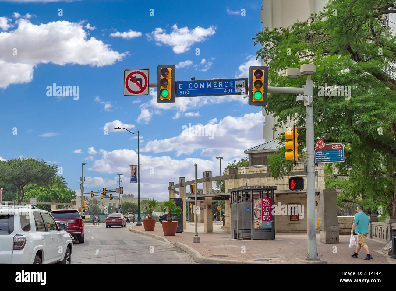 San Antonio, Texas, USA – May 9, 2023: Street view with a stand alone public restroom and traffic signal at Commerce Street and Losoya Street in Downt Stock Photo