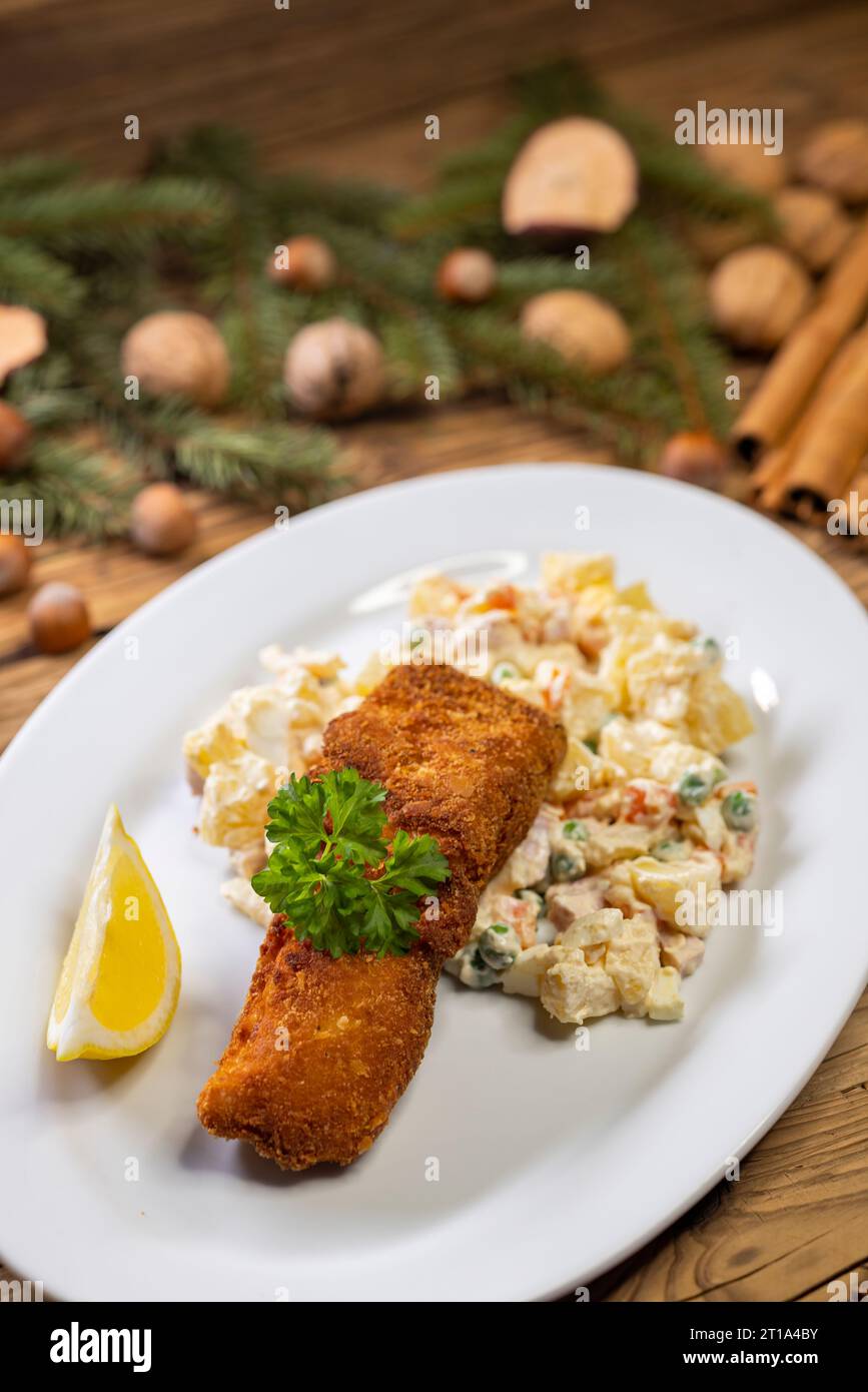 Christmas fried carp with potato salad Stock Photo - Alamy