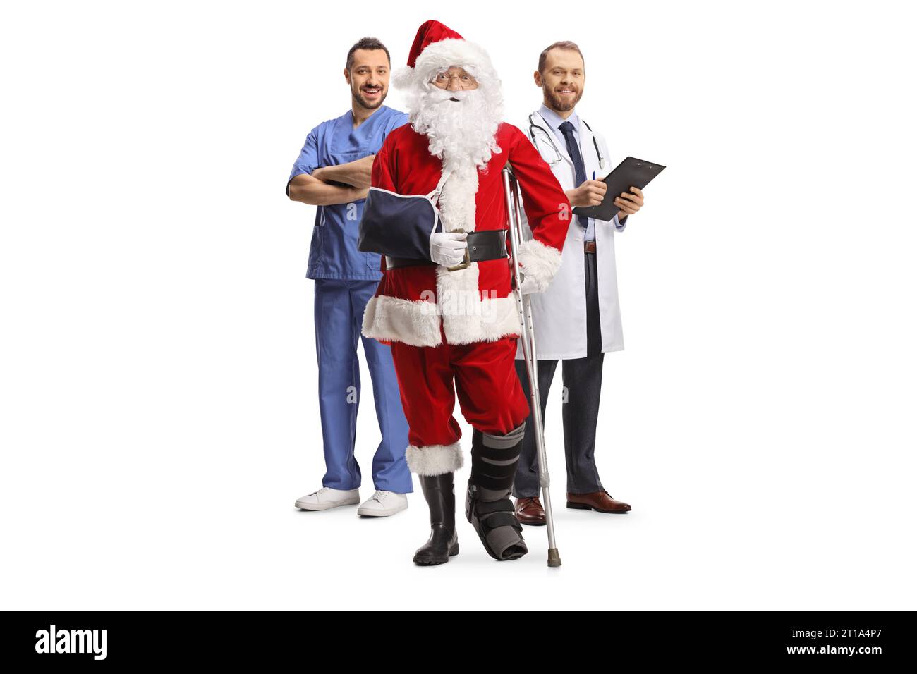 Santa claus with a foot brace and arm sling standing with a medical team isolated on white background Stock Photo