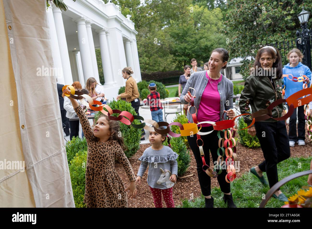 White Houses staff and their families decorate a sukkah in honor of the Jewish holiday Sukkot Friday, September 29, 2023, in front of the East Wing Entrance of the White House..(Official White House Photo byKatie Ricks) Stock Photo