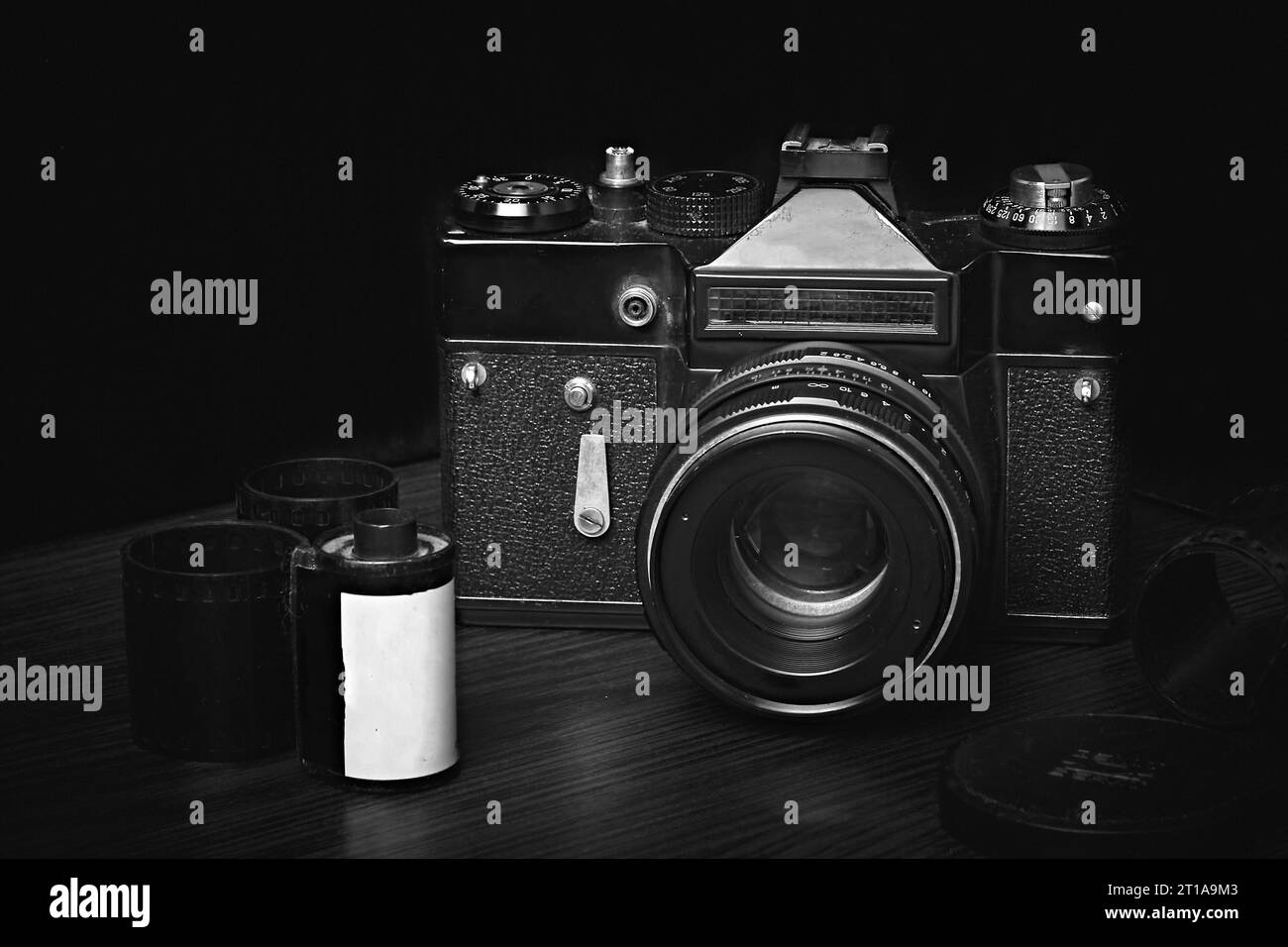 Old film rangefinder SLR camera, film reels, developed film, black and white photography Stock
