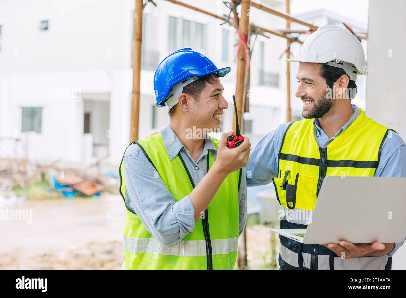 happy foreman meeting with construction engineer manager join coworking team together for building project Stock Photo