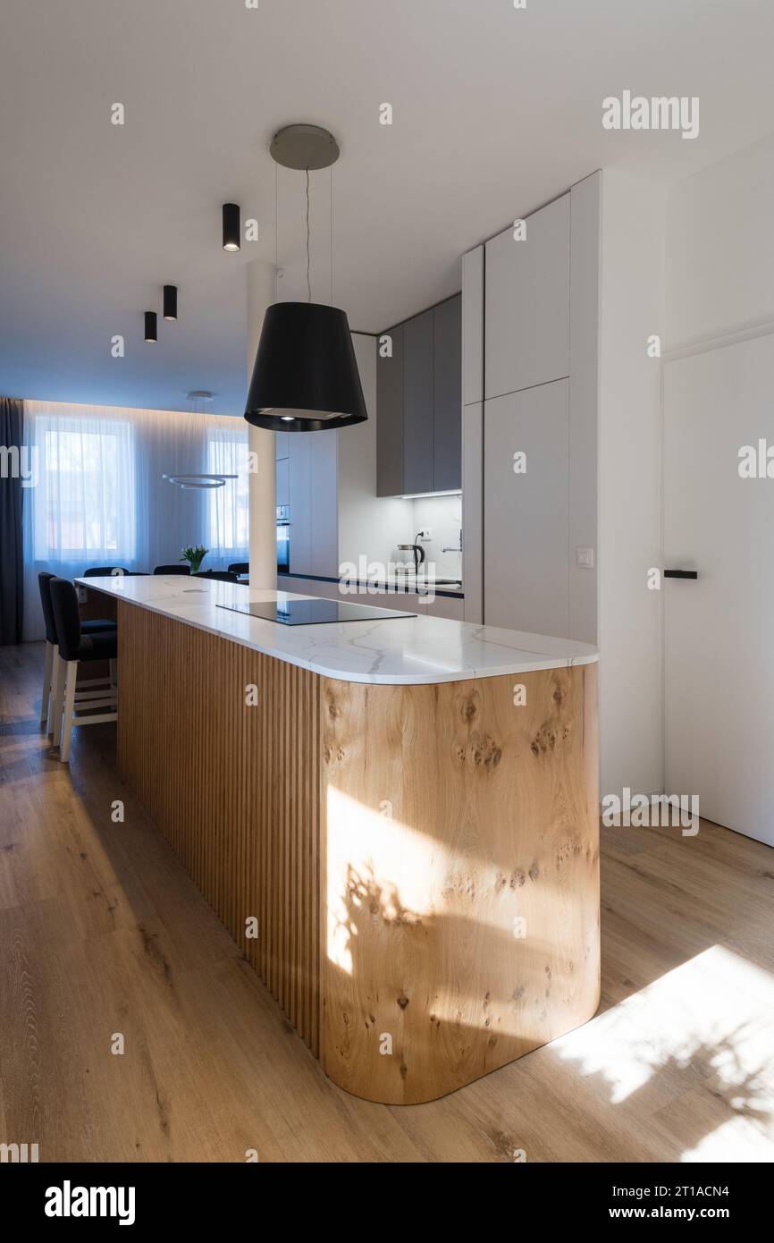 Interior of kitchen with island in modern house Stock Photo