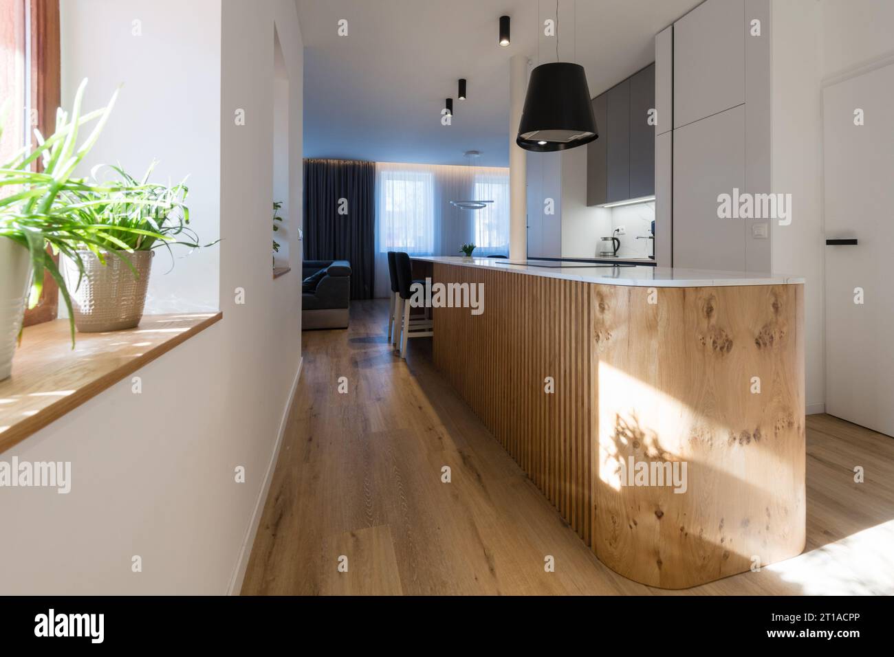 Interior of kitchen with island in modern house Stock Photo