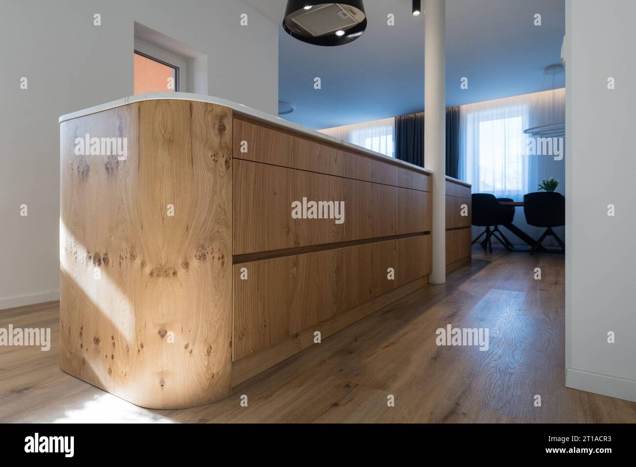 Interior of kitchen with island in modern house Stock Photo