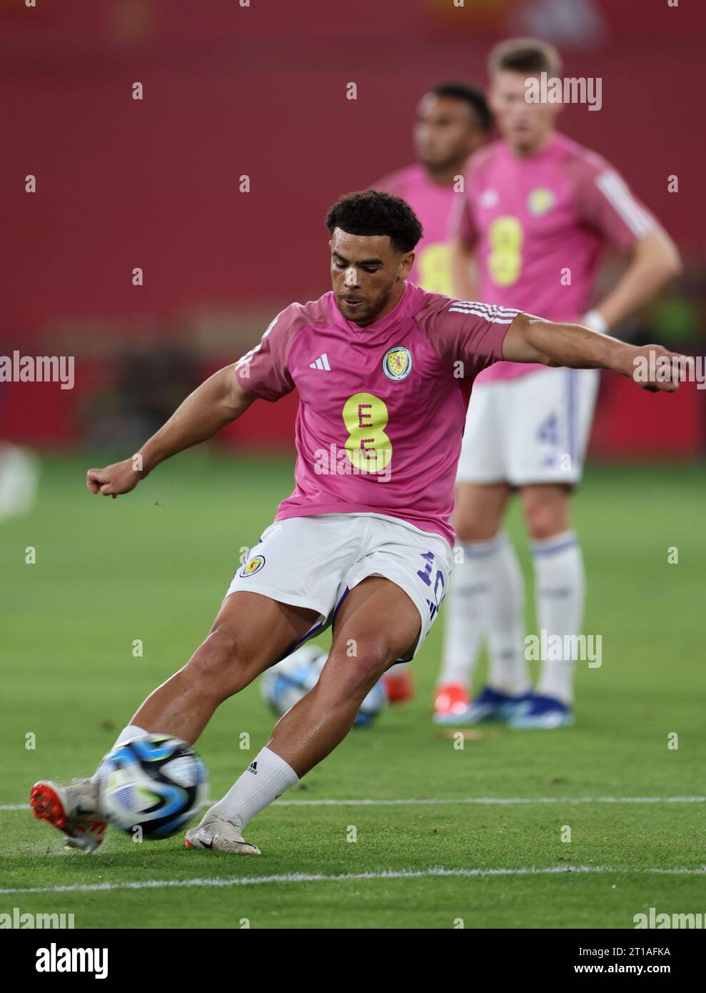 Scotland's Che Adams warming up before the UEFA Euro 2024 Qualifying Group D match at the Estadio La Cartuja de Sevilla in Seville, Spain. Picture date: Thursday October 12, 2023. Stock Photo
