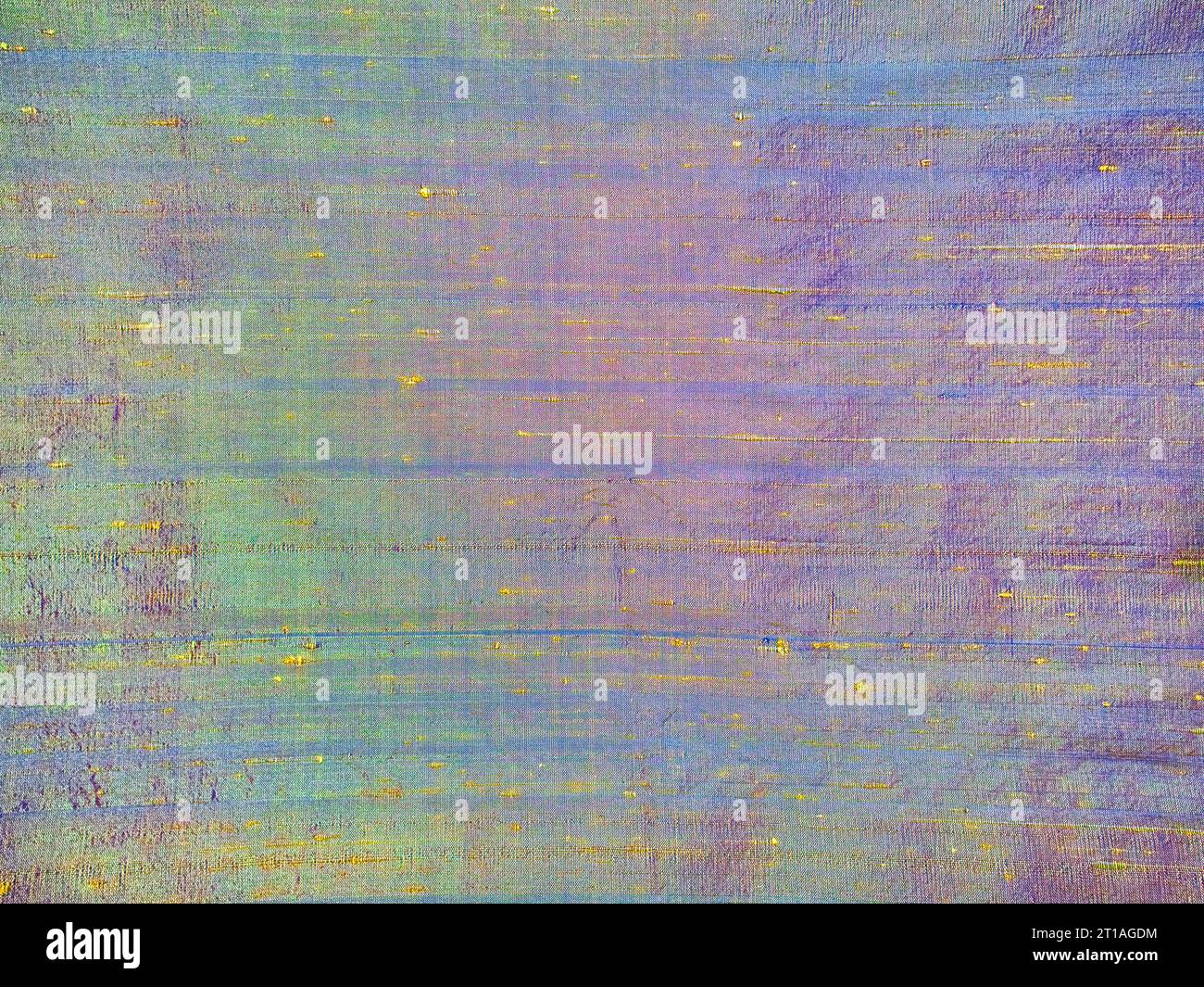 Close up detail of multicolor iridescent gold and purple slubby dupioni silk fabric for background or image detail. Stock Photo
