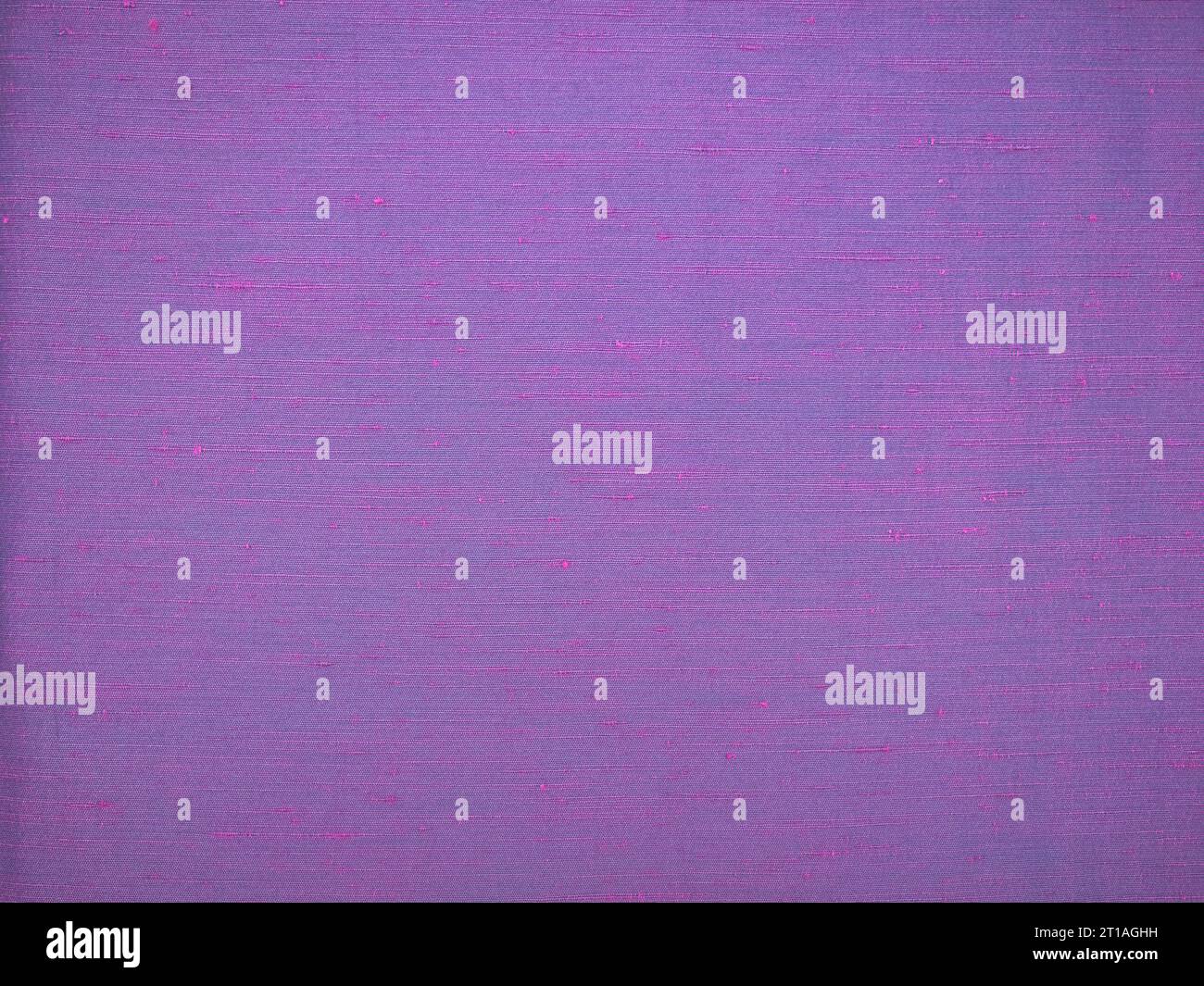 Image close up showing texture of purple dupioni raw silk. Striped slubby texture. For background with text or detailed example. Stock Photo
