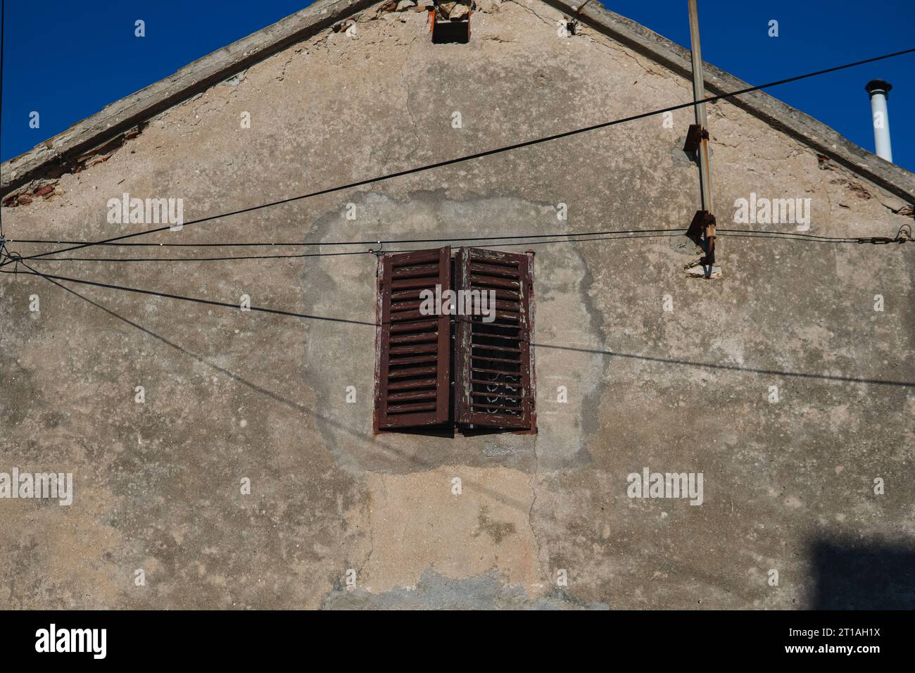 wooden window in the facade of old building Stock Photo