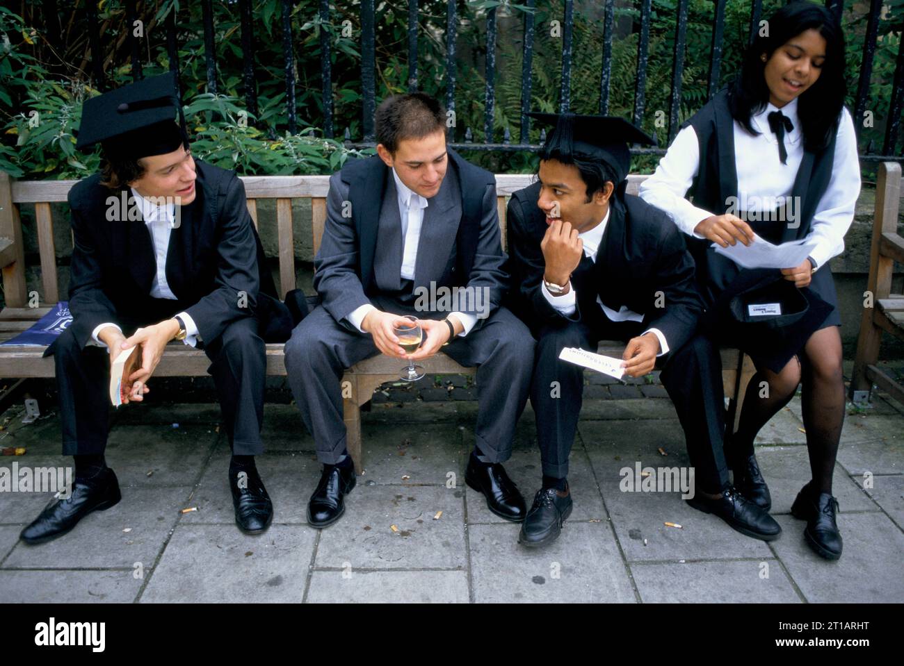 Freshers Week, Oxford University students after matriculation and wearing subfusc, which is a requirement for formal enrolment, students chatting together outside Kings Arms pub. Oxford, Oxfordshire, England circa September 1990s. 1995 UK HOMER SYKES Stock Photo