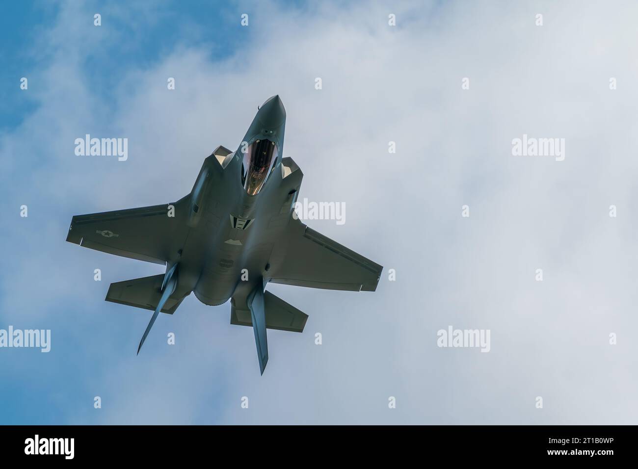 A F-35 fighter jet of the US Airforce Demo Team going upside down during a local airshow Stock Photo