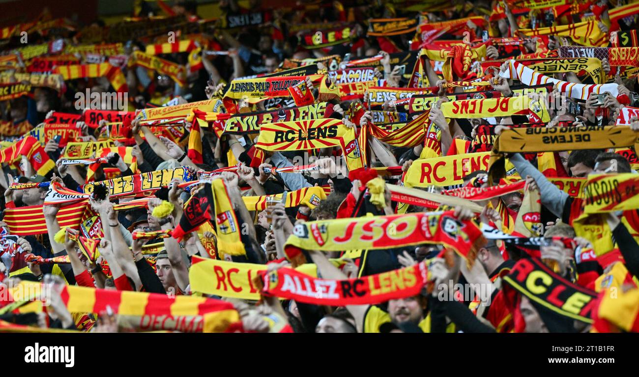 fans and supporters of Lens with their scarf scarfs in tribune ...