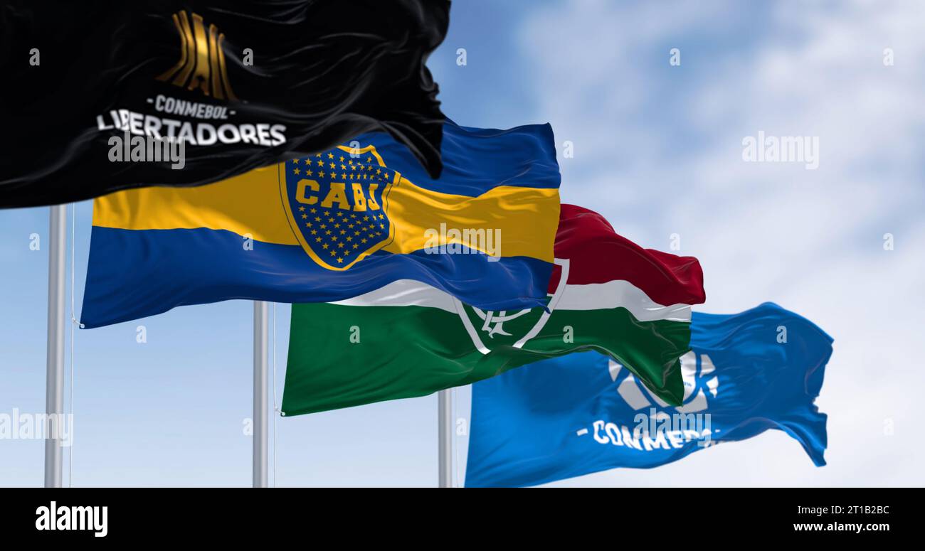 Rio de Janeiro, BR, Oct 6 2023: Conmebol Libertadores, Boca Juniors, and Fluminense flags waving. The final is set for November 4 in Rio de Janeiro. I Stock Photo
