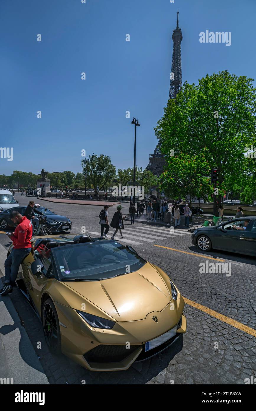Eiffel Tower, in front a Lamborghini Huracan LP610-4 Spyder that you can rent for a ride, Paris, France Stock Photo