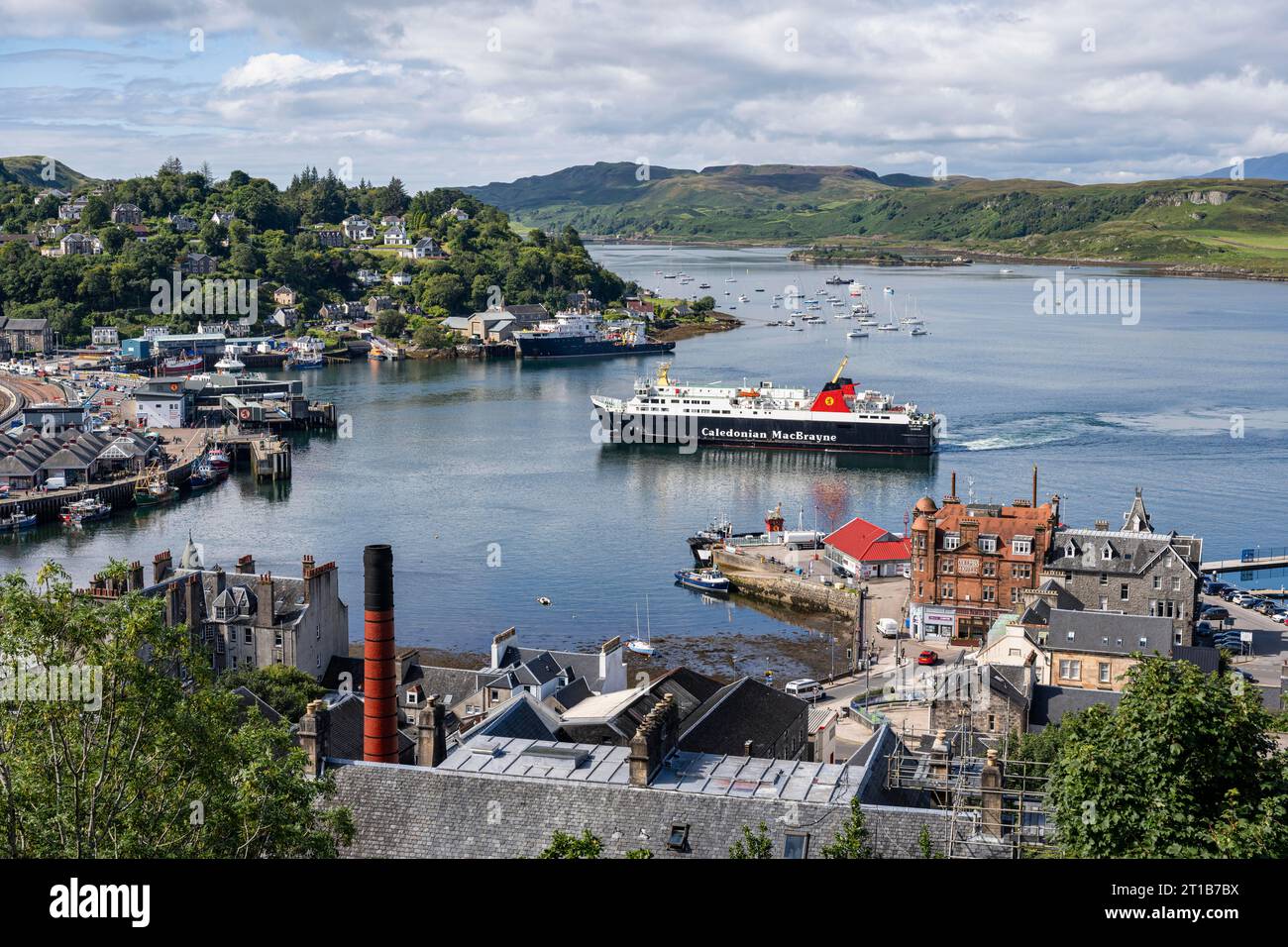 View over the harbour town of Oban to the ferry harbour with the ferry Isle of Lewis operating between Oban and Isle of Barra, Argyll and Bute Stock Photo