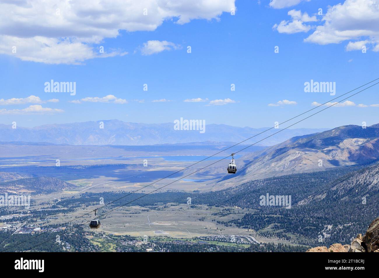 A view of gondolas coming up to the top of Mammoth mountain in Mammoth Lakes, California during a summer time. Stock Photo
