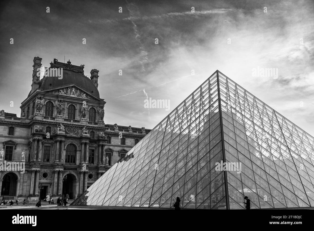 Courtyard and glass pyramid of the Louvre Museum at dusk, Paris, France