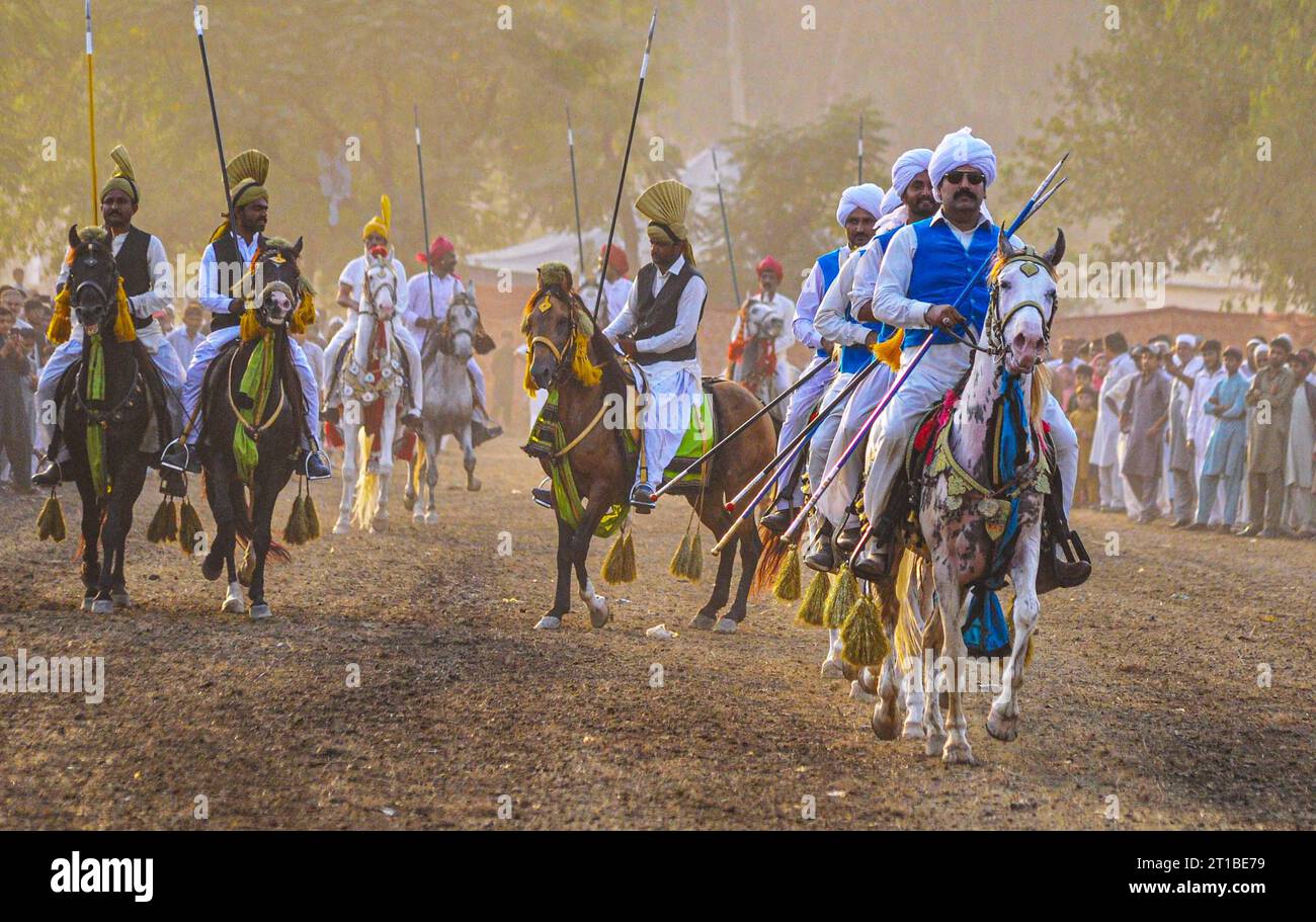 Islamabad, Pakistan. 12th Oct, 2023. Pakistani horsemen charge on a ...