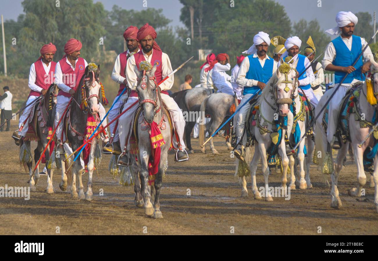 Islamabad, Pakistan. 12th Oct, 2023. Pakistani horsemen charge on a ...