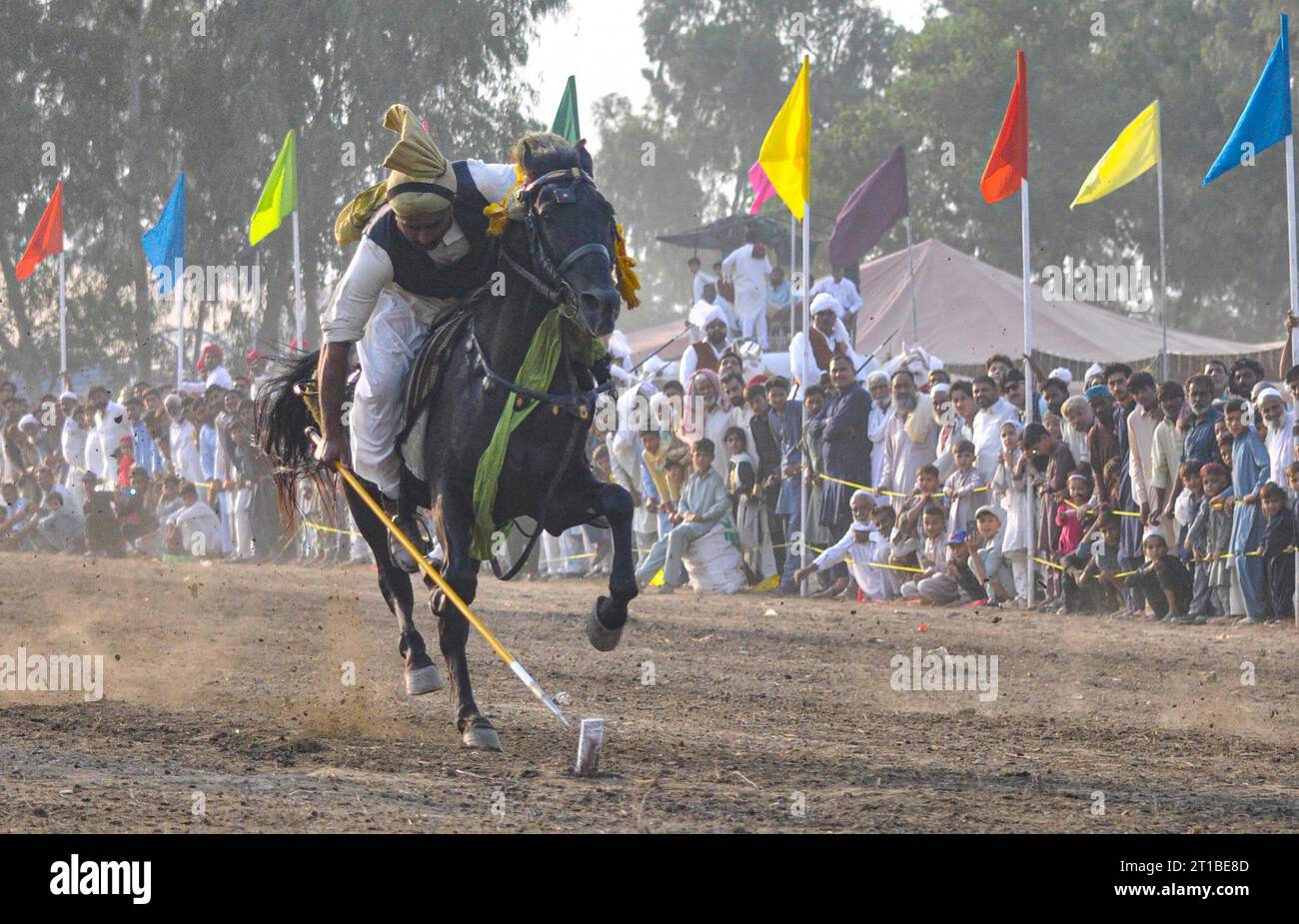 Islamabad, Pakistan. 12th Oct, 2023. Pakistani horsemen charge on a ...