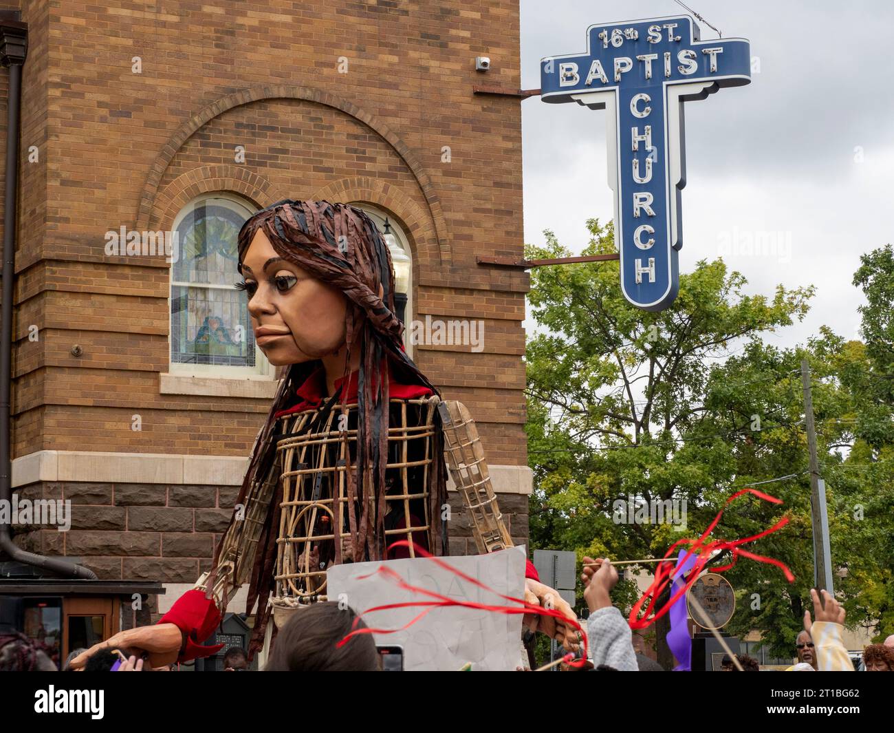 Birmingham, Alabama, USA. 12th Oct, 2023. Little Amal, the puppet representing a 10-year old Syrian refugee girl, stands In front of the 16th Street Baptist Church. Four girls were killed in that church in a racially motivated 1963 bombing. (Credit Image: © Sue Dorfman/ZUMA Press Wire) EDITORIAL USAGE ONLY! Not for Commercial USAGE! Stock Photo