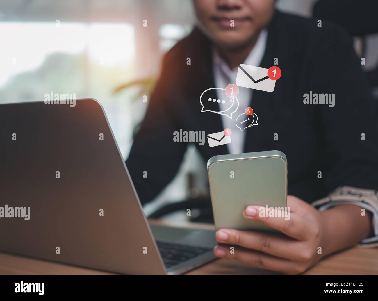 Businesswoman uses smartphone to check new email. New email notification ideas for business email communication and digital marketing. Electronic mess Stock Photo