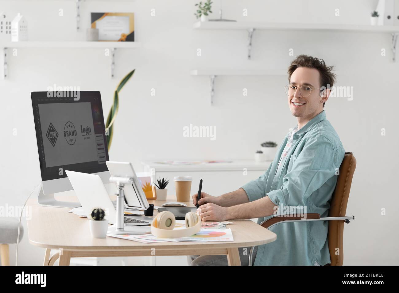 Male graphic designer developing logotype in office Stock Photo
