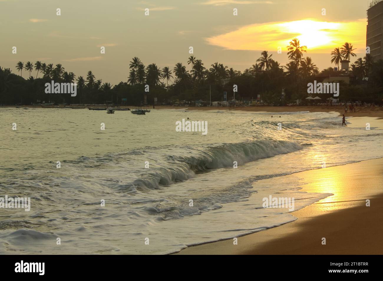 sunset-over-the-unawatuna-beach-sri-lanka-wallpaper-background-image