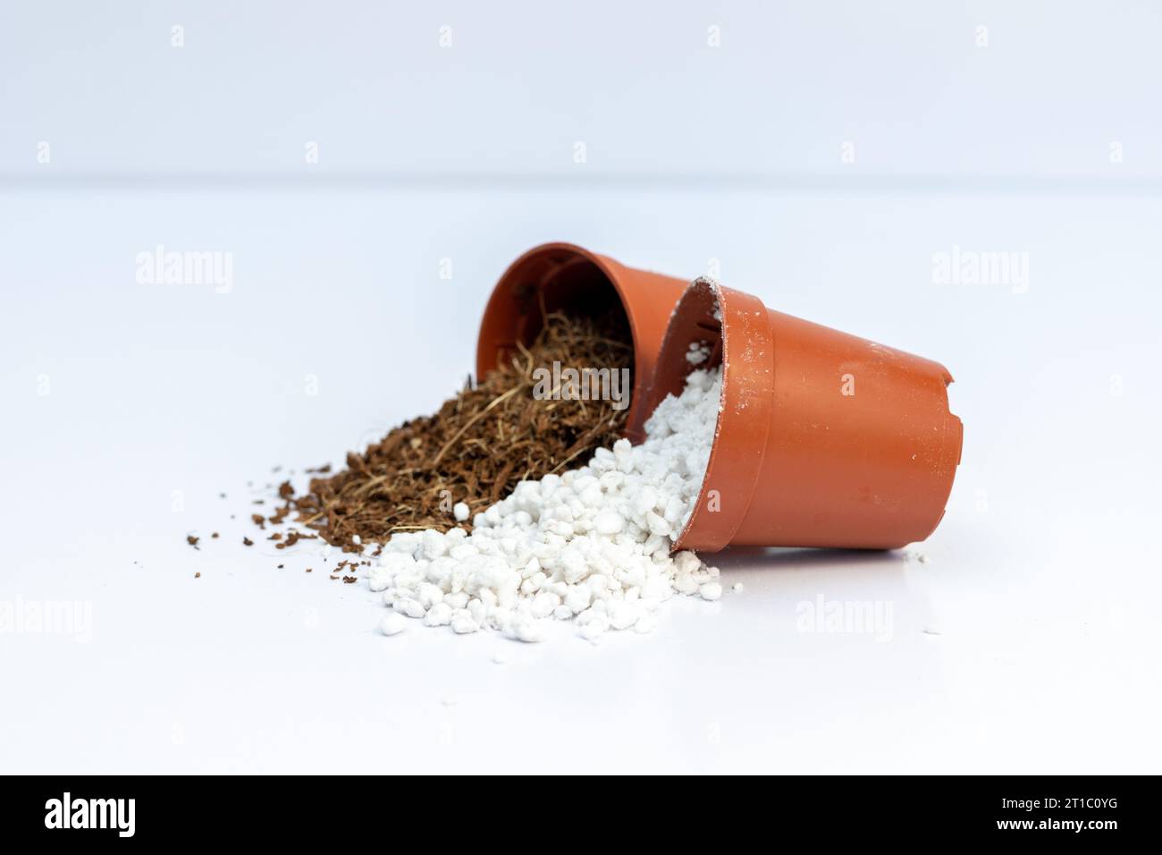 A mixture of perlite and cocpeat in small plastic pots. Soil mix concept for plants. Stock Photo