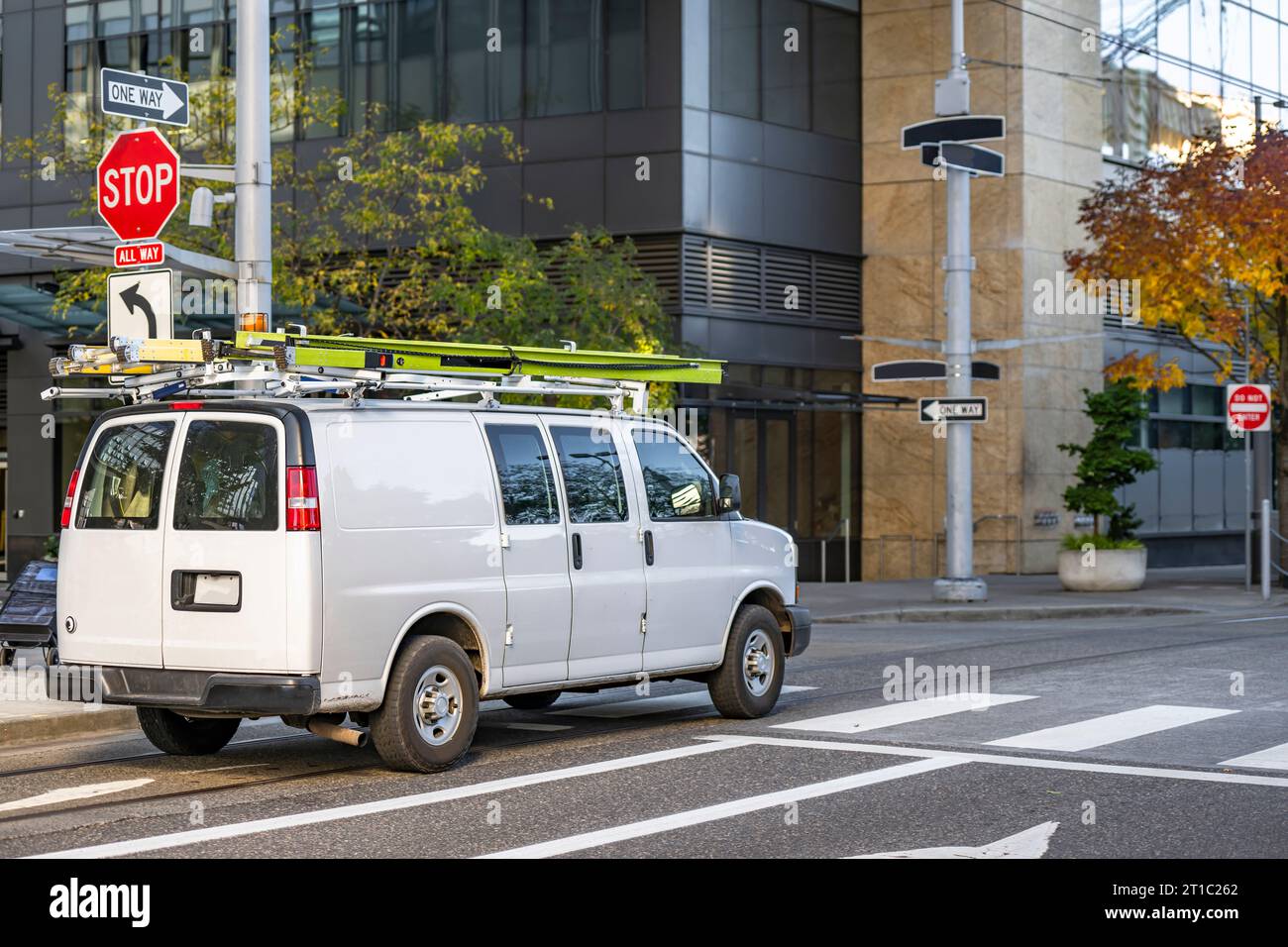 White compact light duty maneuverable economical cargo mini van with