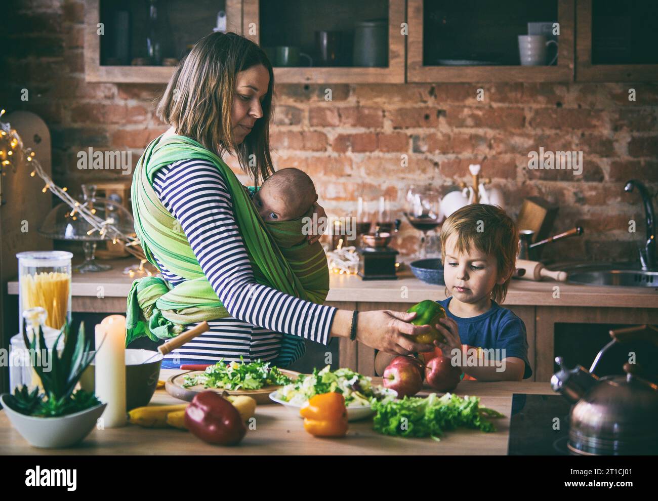 Happy young family, beautiful mother with two children, adorable ...