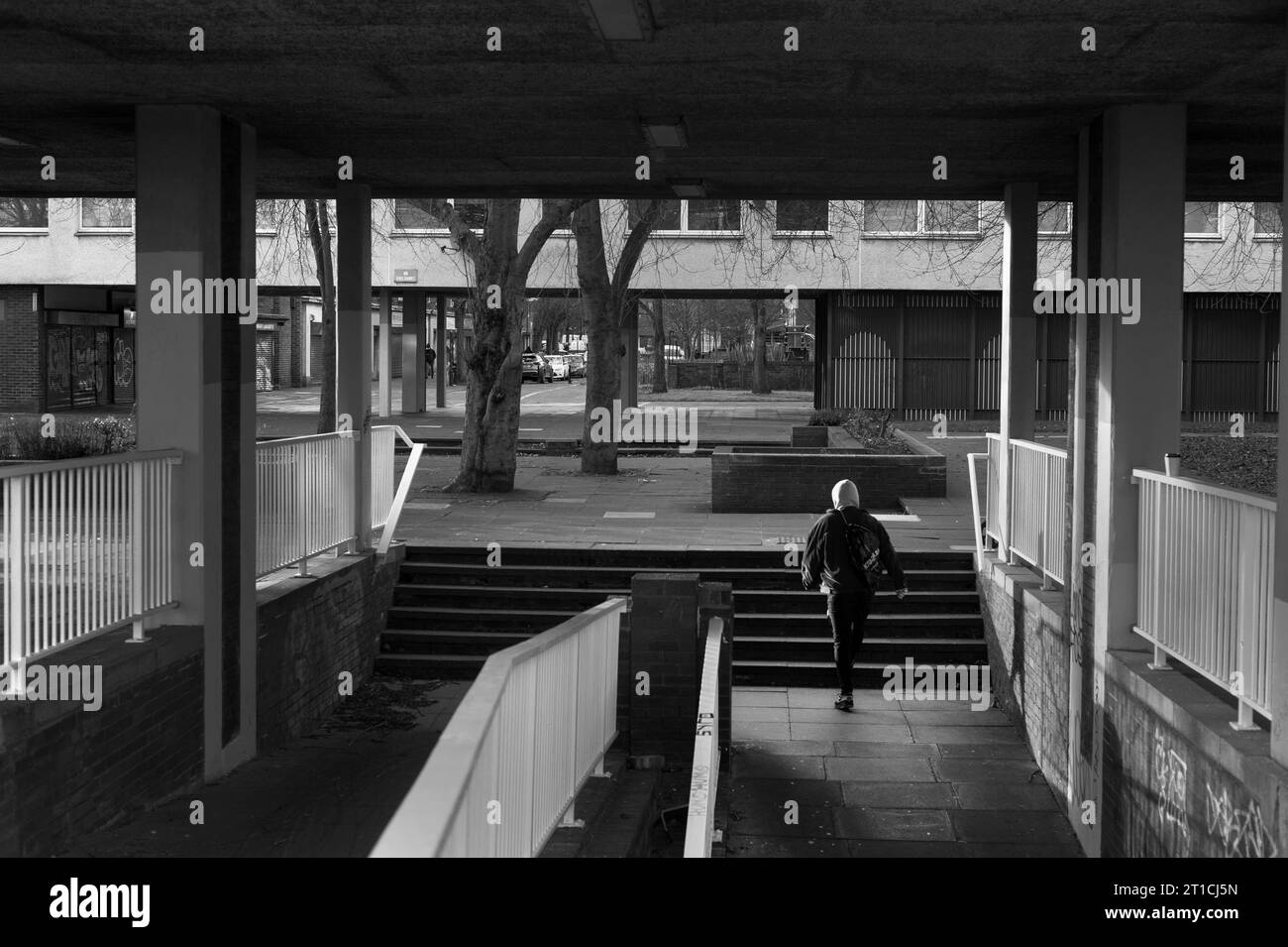 Student walking through housing estate,Shieldfield, Newcastle upon Tyne