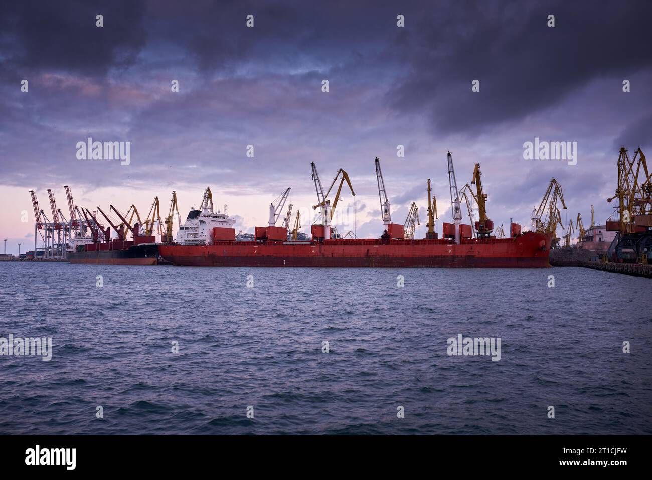 cargo ship in port - large container ship docked Stock Photo - Alamy