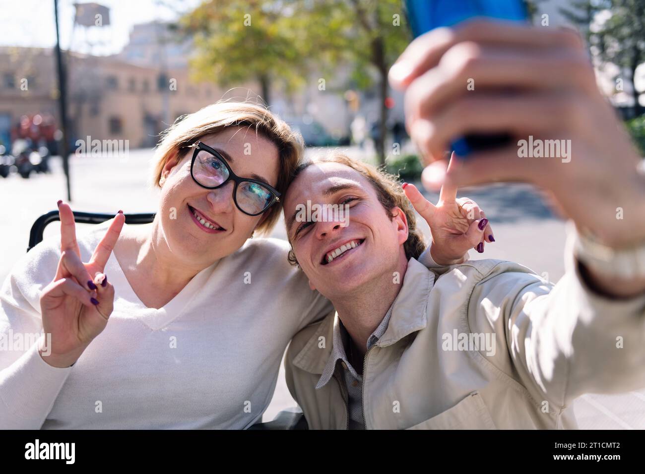 happy couple taking selfie with mobile phone Stock Photo