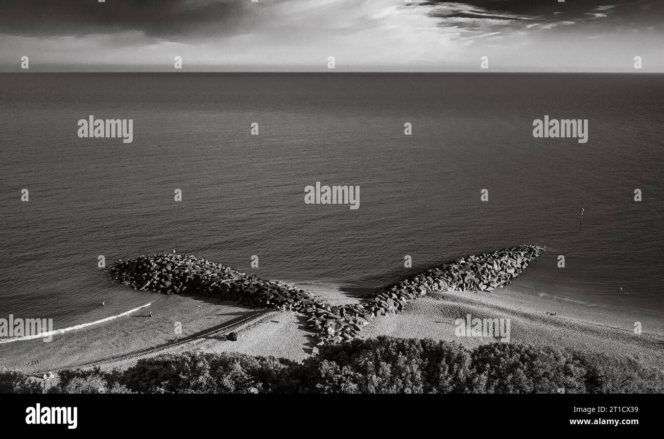 Looking down on rocky sea defences and breakwaters on Mermaid Beach from the The Leas in Folkestone, Kent, UK. Stock Photo