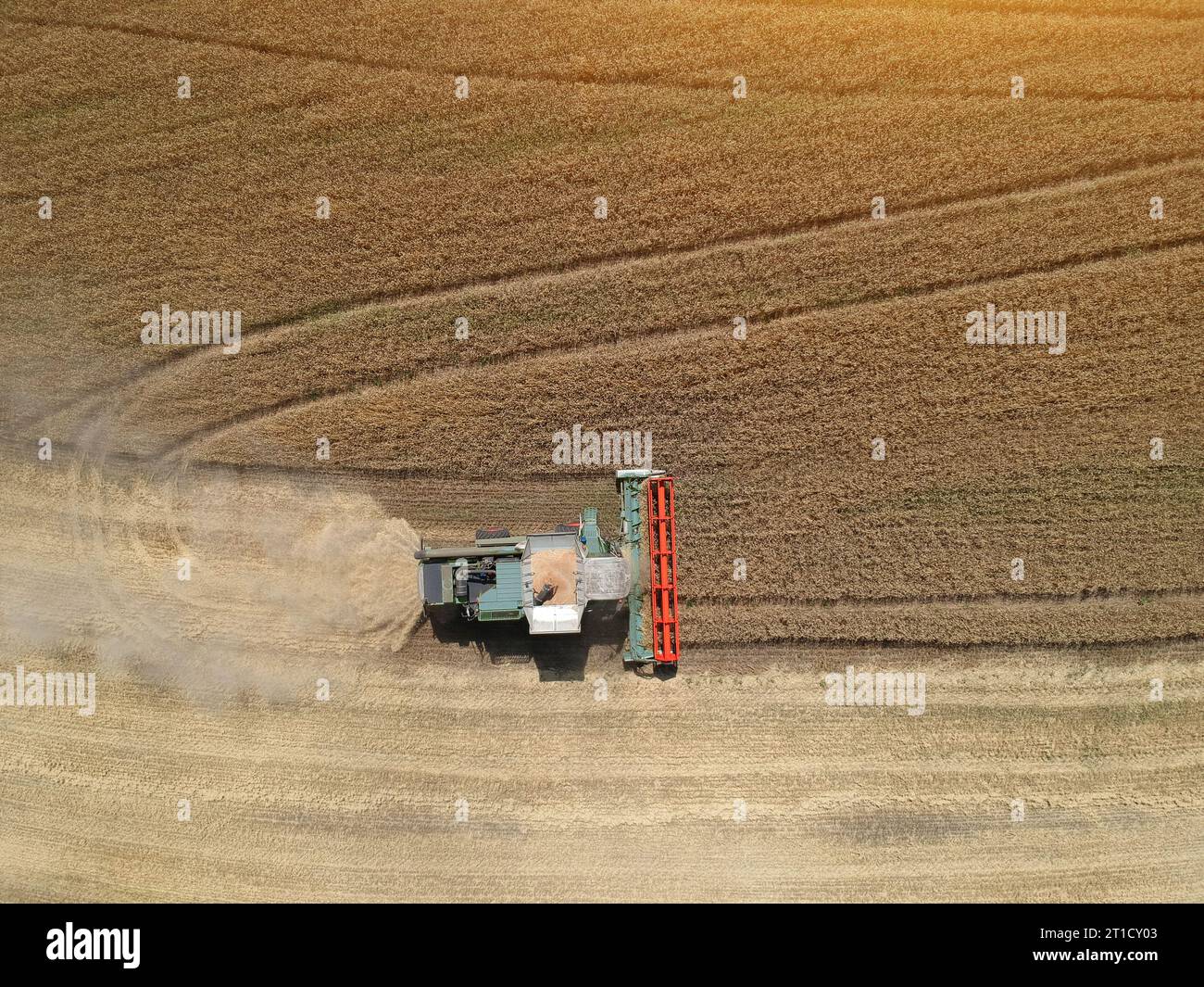 Aerial View of a combine harvester working in the fields. Drone photo ...