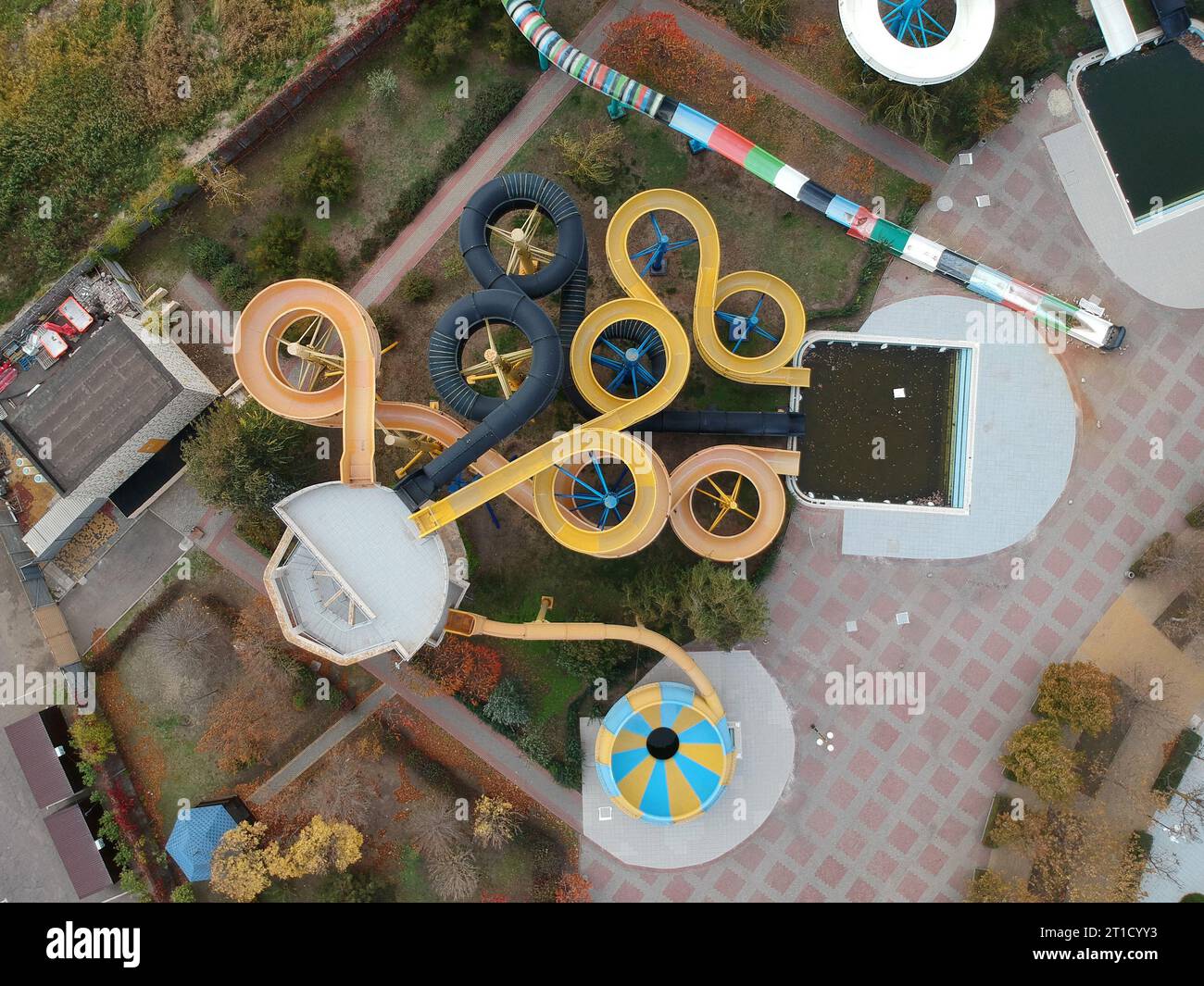 Aerial photo of small aqua park with colorful tubes, view from above, abandoned, nobody. Stock Photo