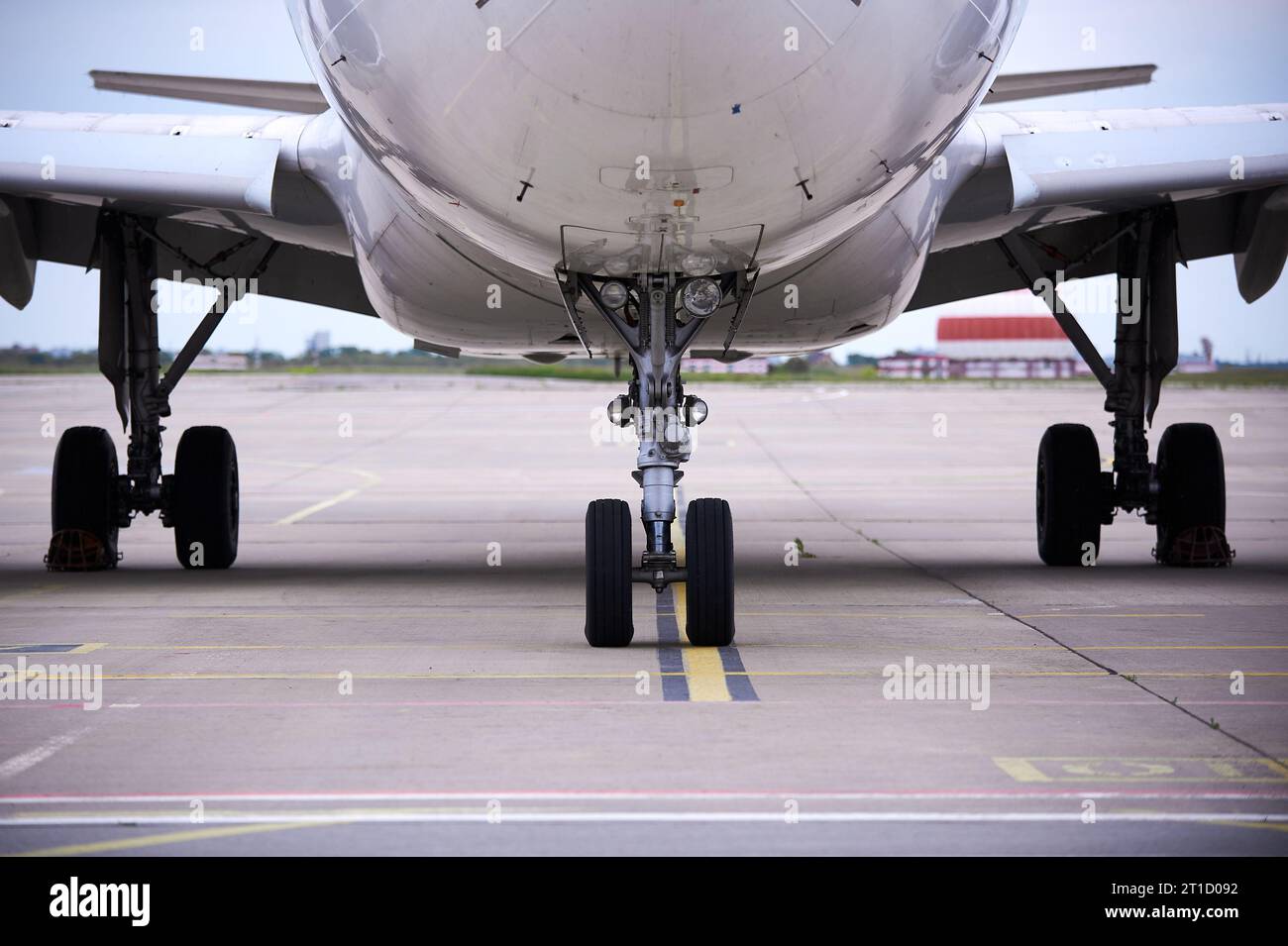 Front landing gear of big passenger aircraft closeup high detailed view. nobody Stock Photo