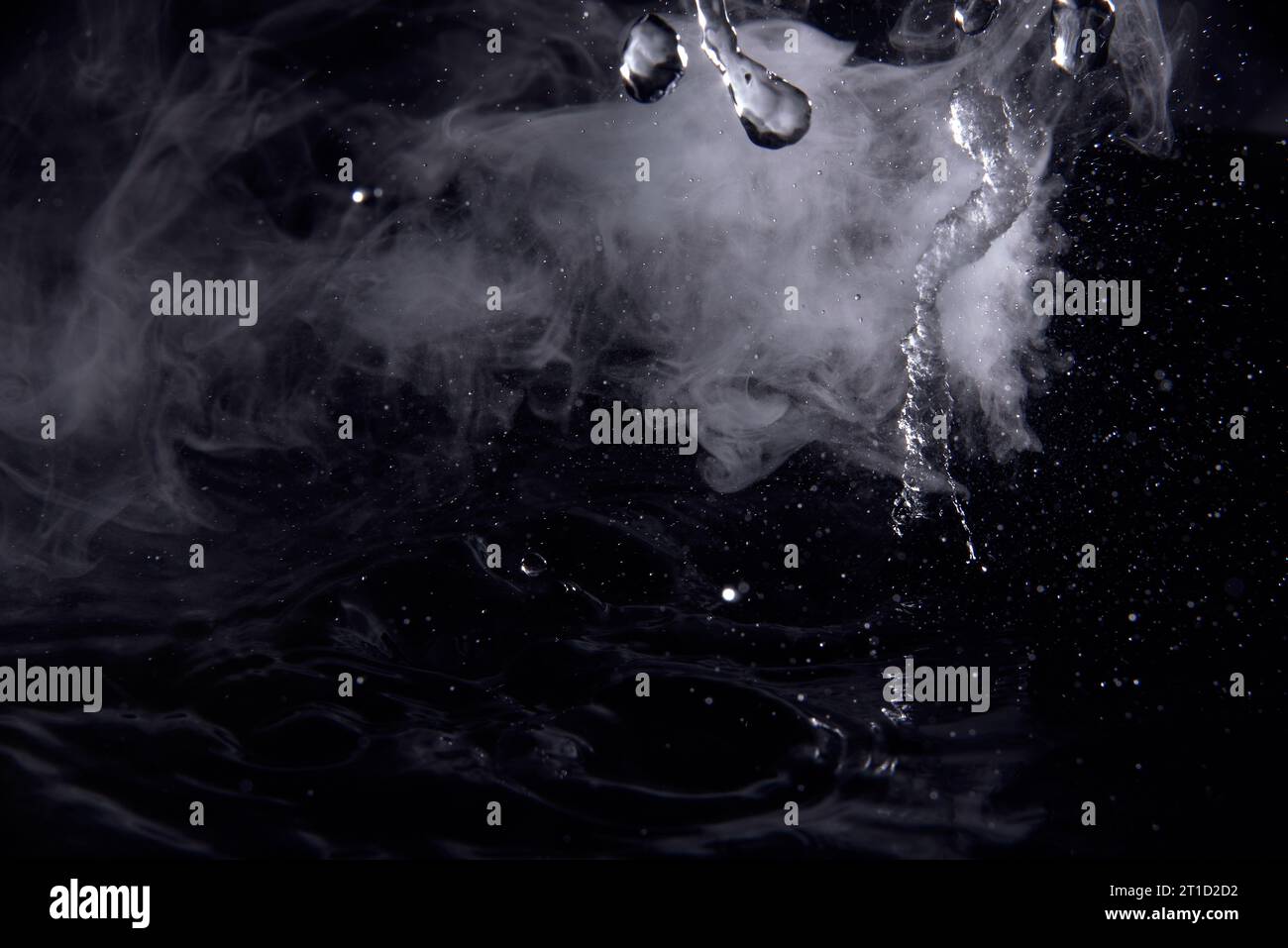 Boiling water splash with steam on black background closeup Stock Photo ...