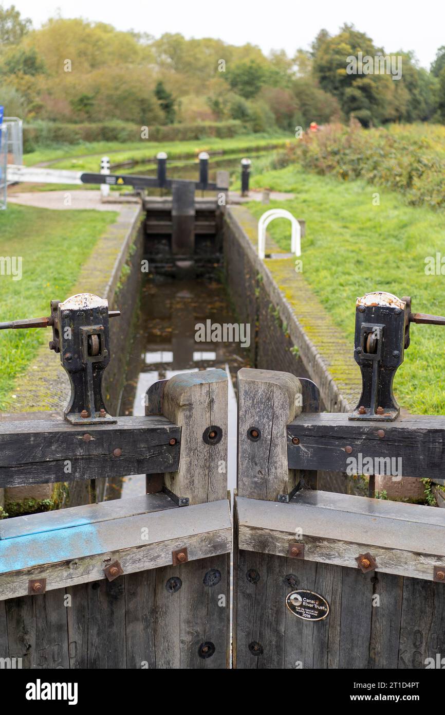 View down the length of a British canal lock. Stock Photo