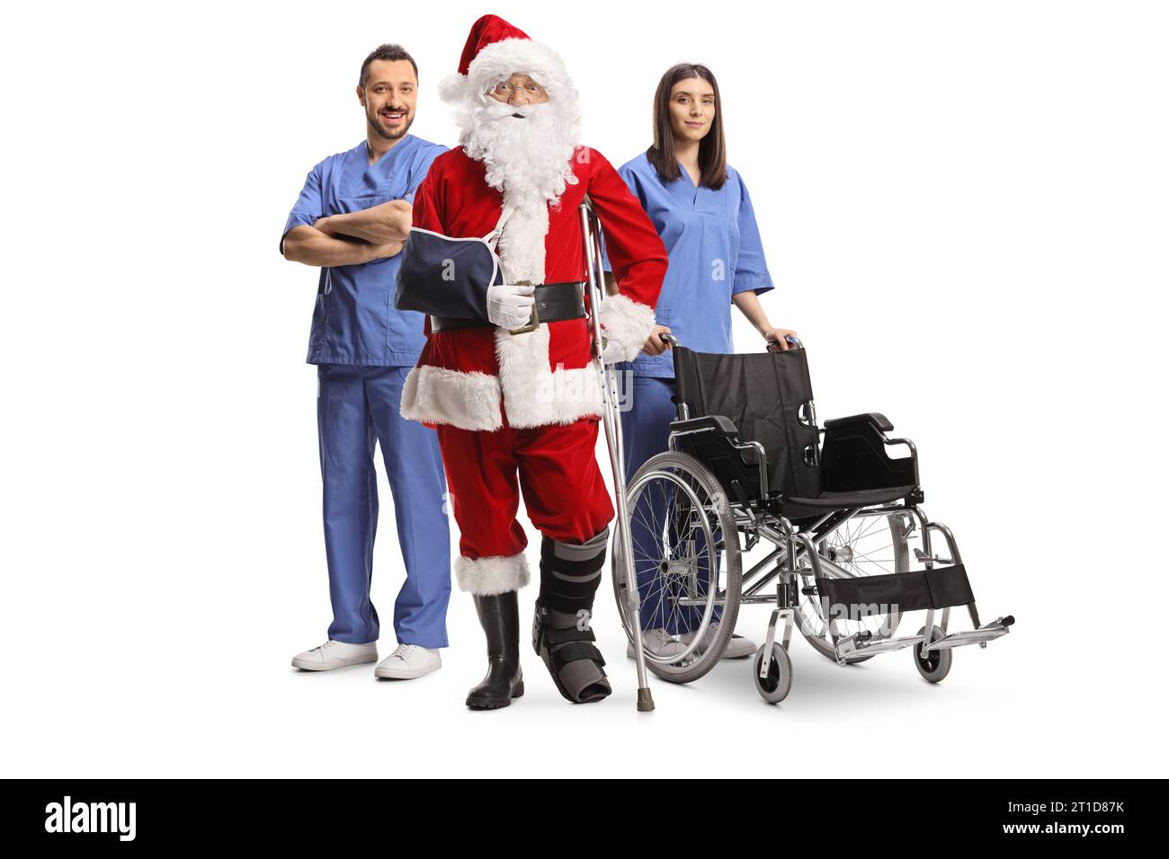 Injured santa claus with a foot brace and arm sling standing with a medical team isolated on white background Stock Photo