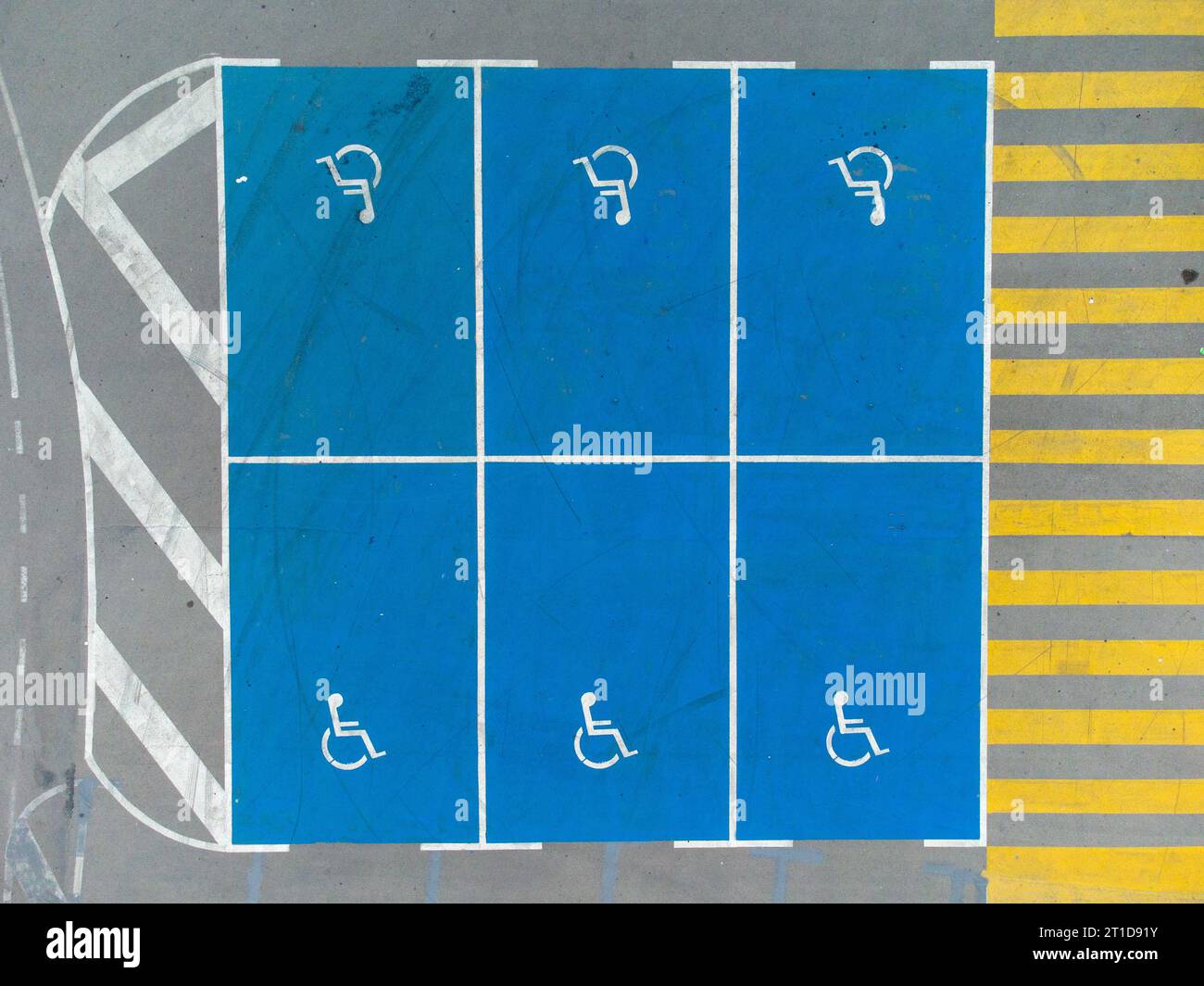 Empty parking lot with car spaces for people with disabilities, aerial ...