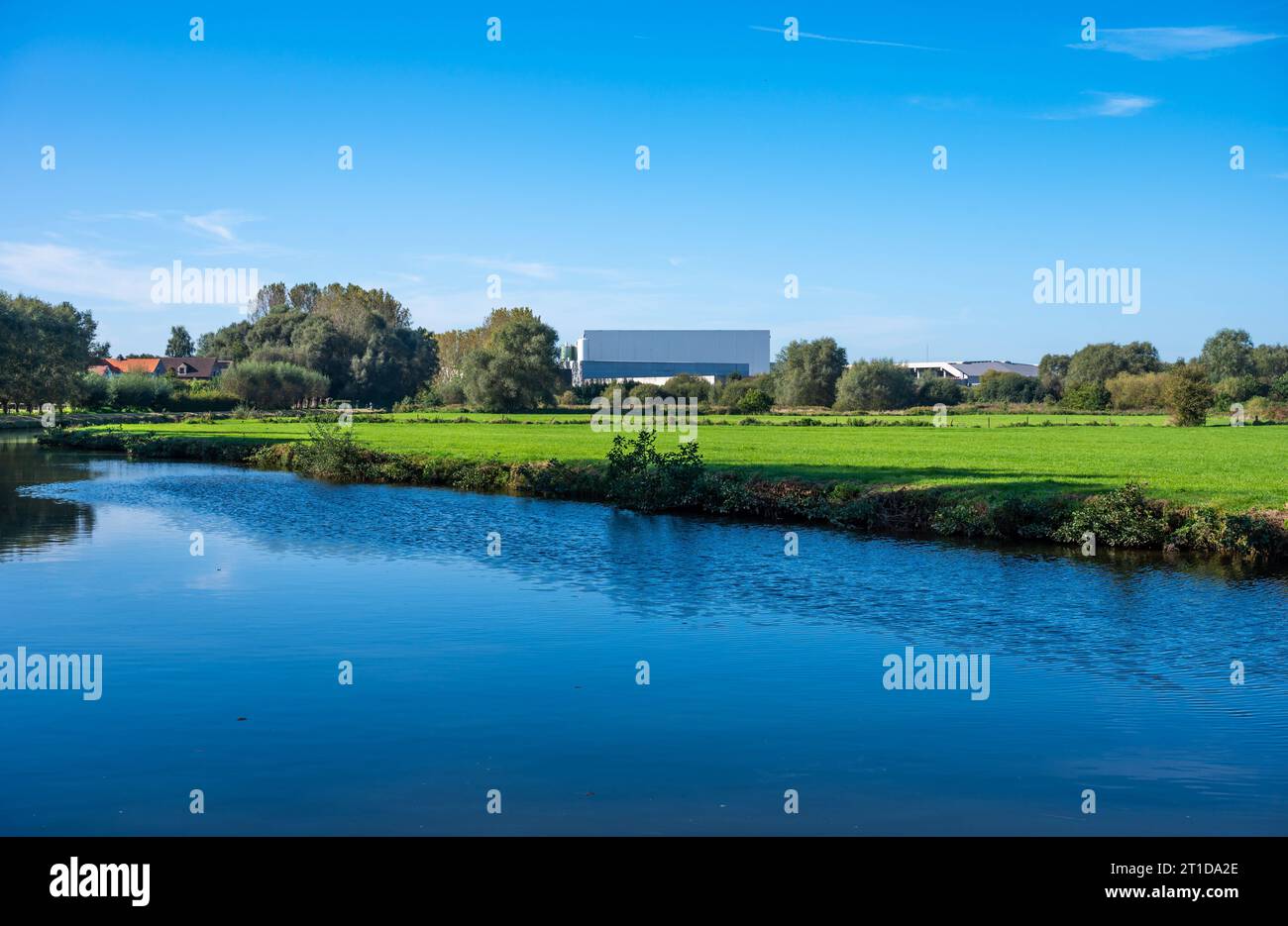 Industrial buidling reflecting in the water of the river Dender, Ninove, East Flemish Region, Belgium Credit: Imago/Alamy Live News Stock Photo