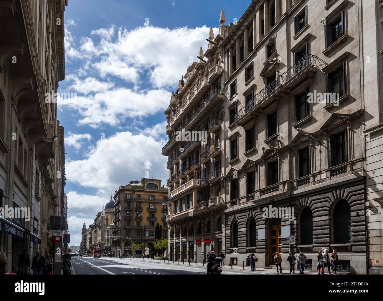 Barcelona, Catalonia, Spain May 01 2017 - Looking down Vía Layetana showing the different styles of buildings with Casal Del Metge on the right side Stock Photo