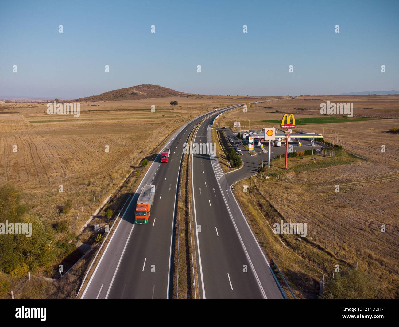 Drazhevo - november 1, McDonald's McDrive sign at Shell gasl station on a highway in the evening aerial view on 1 november Drazhevo Bulgaria Stock Photo