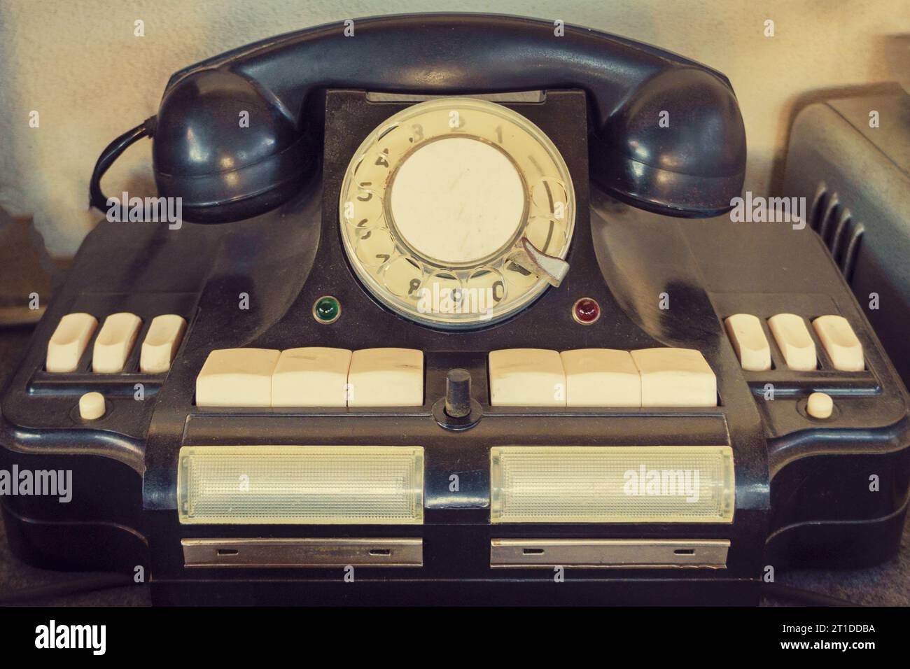 Old telephone with dust and scratches. Wired communications equipment